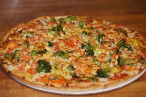 onion,tomatoes,broccoli and banana peppers pizza